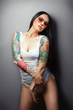 sexy glamorous girl with tattoos.