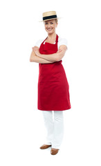 Beautiful confident chef posing in style, arms folded