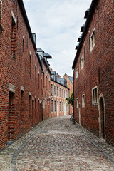 Narrow cobblestone street of  city of Leuven