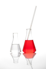 Two conical classic laboratory flasks with a reagent