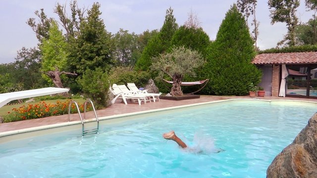 boy diving into pool