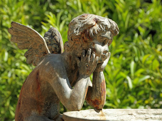 figure of angel - detail of the fountain in garden of Villa Peyr