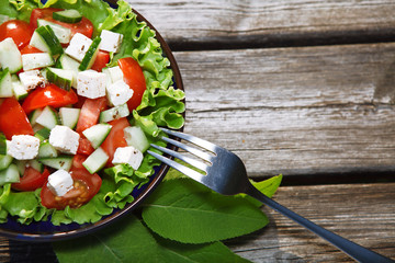 Fresh salad with tomatoes and cucumbers. green