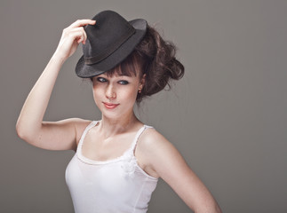 portrait of a beautiful girl with freckles and black hat