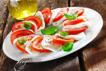 Colourful slices of cheese and tomato