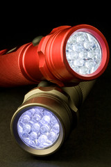 Two Modern LED Flashlights - Turned On