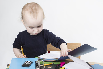 young child at writing desk