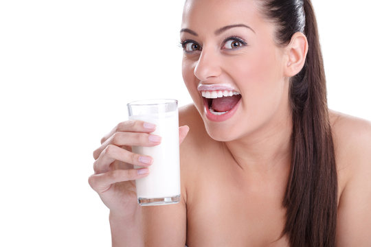 Funny girl with glass of milk
