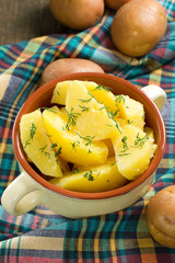 Boiled potatoes with dill and butter