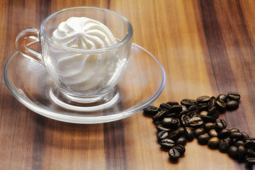 coffee cup stuffed with meringue and coffee beans