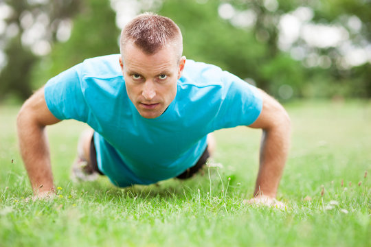 Man Doing Press Ups Outdoors