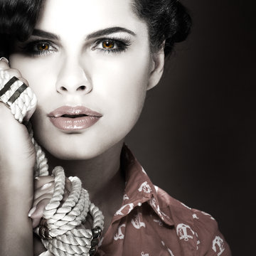 Fototapeta A photo of beautiful brunette is in style of pinup, glamur
