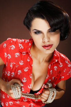 Fototapeta A photo of beautiful brunette is in style of pinup, glamur