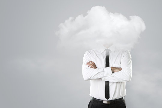 Young Businessman With Head In The Clouds