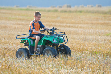 Boy riding a quad bike