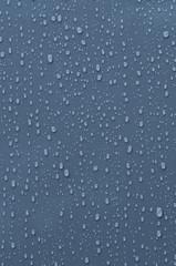 Water Droplets on Blue Metallic Surface
