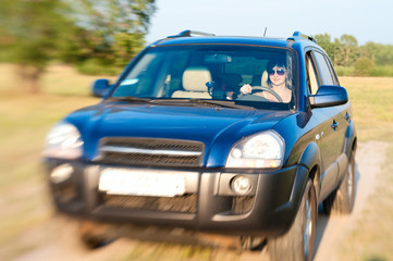 Offroad car drive with woman steering