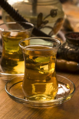 Cup of turkish tea and hookah served in traditional style