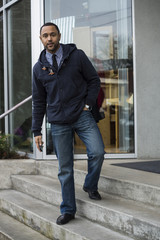 Young Black Man on Steps looking at Camera