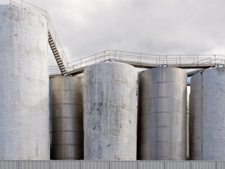 Group of large steel storage tanks at refinery