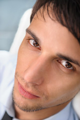 Closeup portrait of confident young businessman