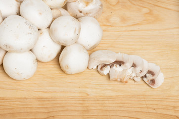 Button mushrooms sliced on table
