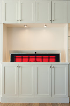 A TV is lowered by an automic TV lifter