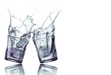 Water splash in two glasses
