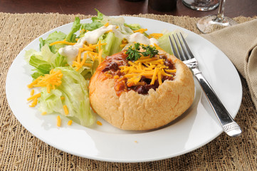 Chili con carne in a bread bowl