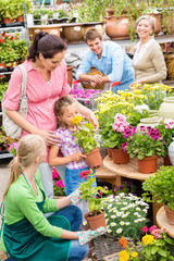Family garden center shopping for flowers