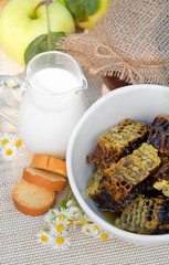 fresh honey combs, milk and fresh apples