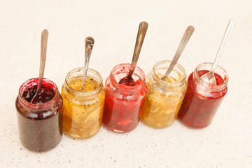 different jars full of fruity jam