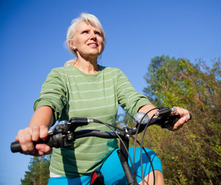 Mature Woman With Bicycle