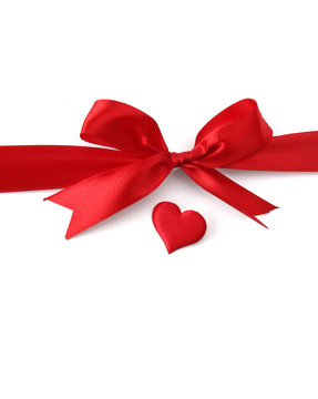 satin gift bow and red heart, isolated on white background