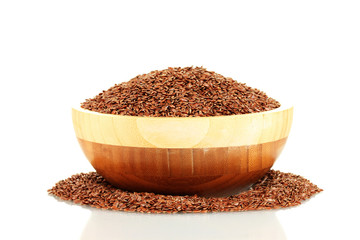 flax seeds in wooden bowl isolated on white background