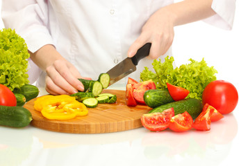 woman hands cutting vegetables on kitchen blackboard