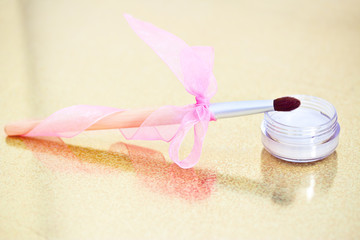 eyeshadow and makeup brush with bow