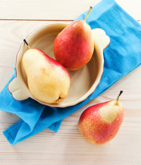 Fresh pears on a wooden table