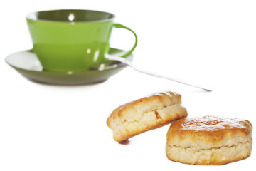 Two buttery scones and tea cup