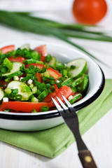 Cucumber, tomatoes and green onion salad
