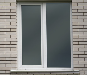 Fototapeta premium White brick wall and window