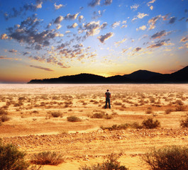 Fototapeta premium Lonely man in a desert
