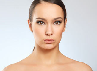 Close-up portrait of woman, isolated on white background