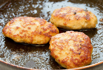 Meatballs cooking in a pan