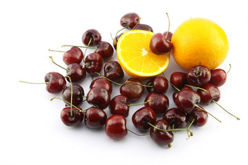 Fresh navel orange and fresh cherry