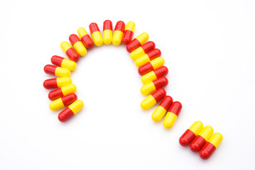 capsules line up as a question mark