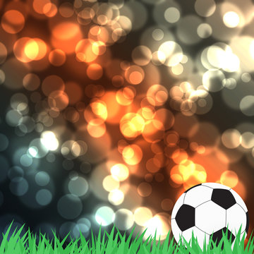 Football with green grass on color abstract  background