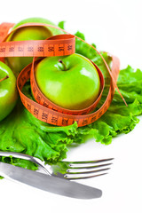 green apple with measure tape