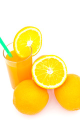 orange juice in glass on white paper