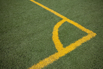 Soccer (football) field corner with yellow lines